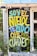 A vibrant piece of graffiti art on a wall among green foliage. The graffiti features the text 'SOY EL NIÑO, TE PIDO QUE ME CUIDES!' in bright colors such as yellow, turquoise, and purple on a black background. The wall is part of a building with a corrugated metal roof.