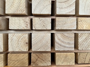 Finished beams of yarn ready for delivery stacked neatly.