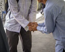 a couple of men standing next to each other