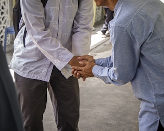 a couple of men standing next to each other