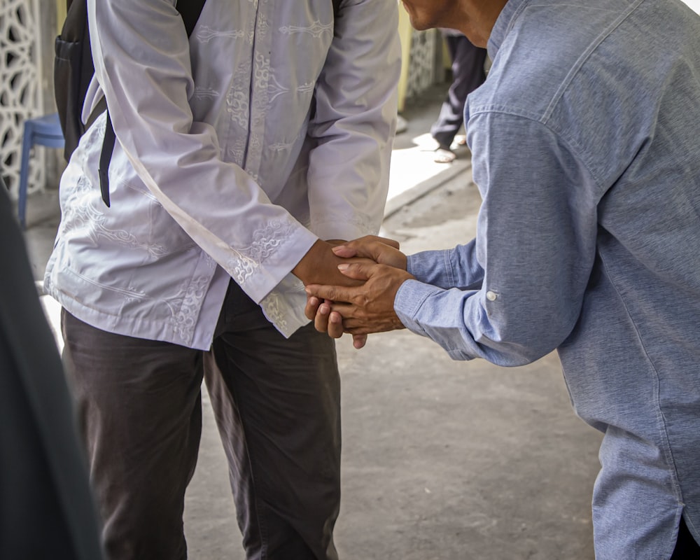 a couple of men standing next to each other