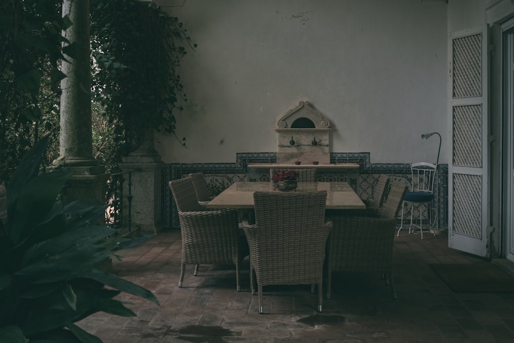 a dining table and chairs on a patio