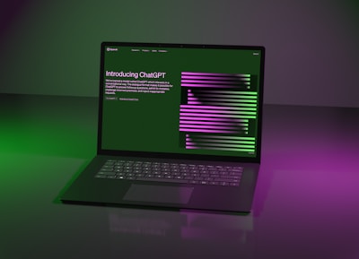 a laptop computer sitting on top of a table