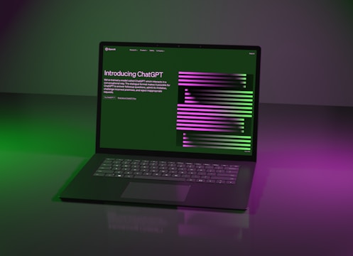 a laptop computer sitting on top of a table