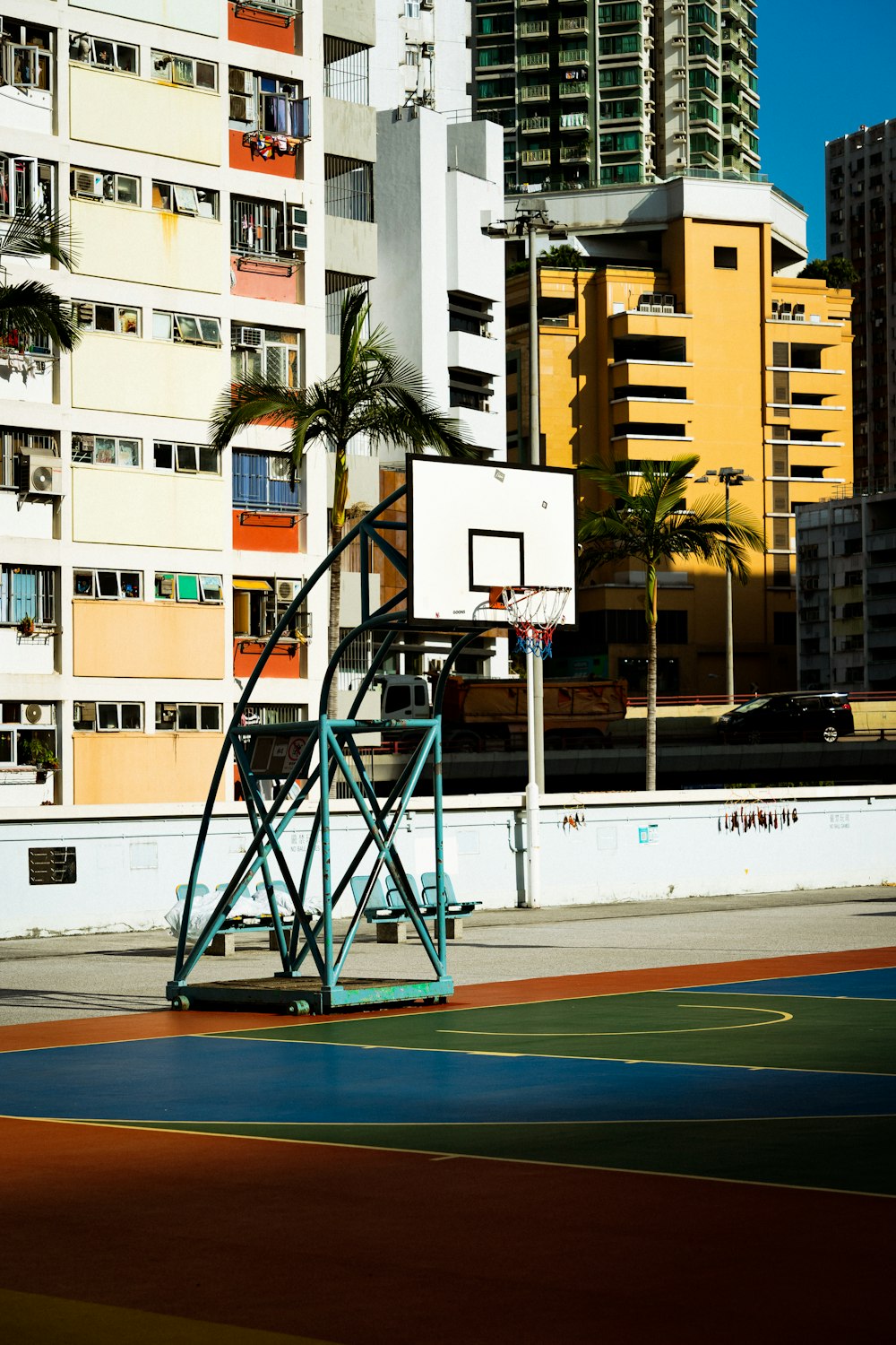 a basketball court in front of a tall building