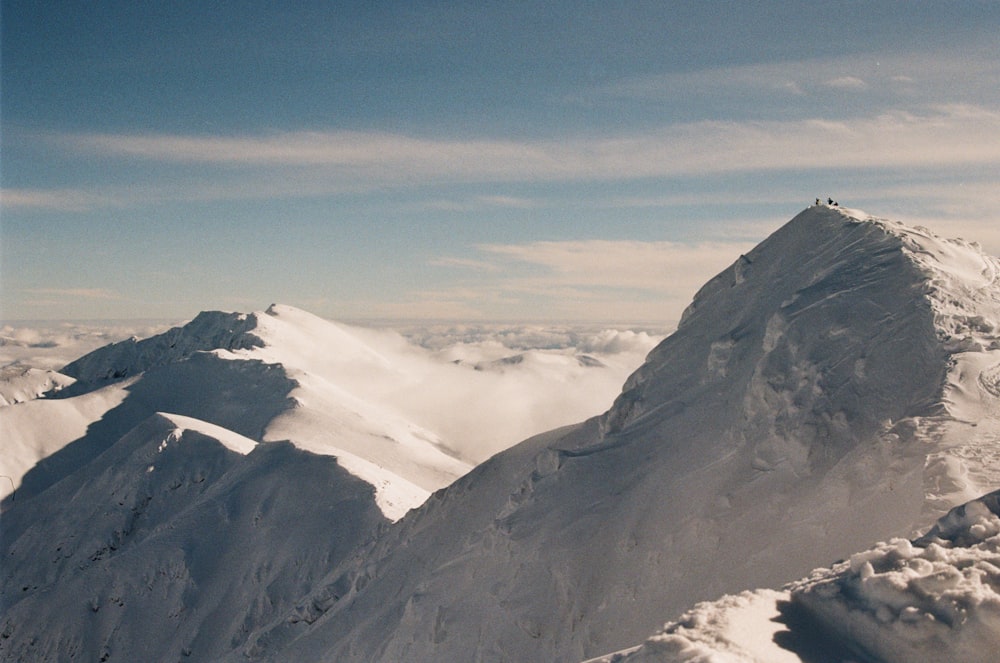 a person on a snowboard on top of a mountain