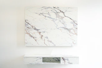 Finished marble-topped console table displayed in a bright, modern room.