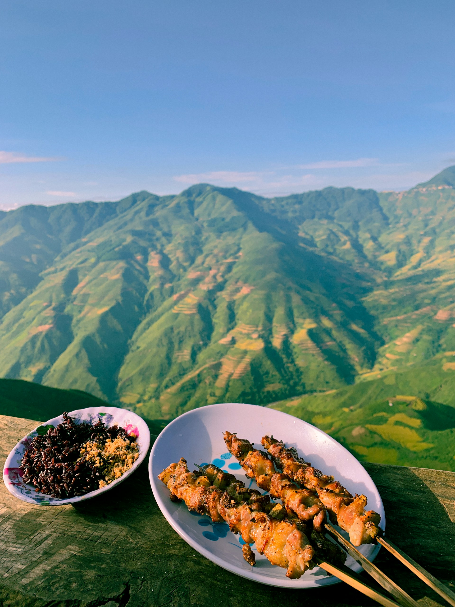 woman wearing yellow long-sleeved dress under white clouds and blue sky during daytime