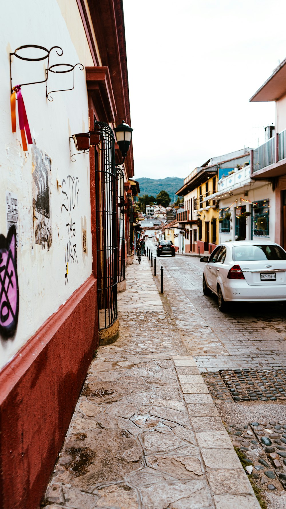 a street with cars parked on the side of it