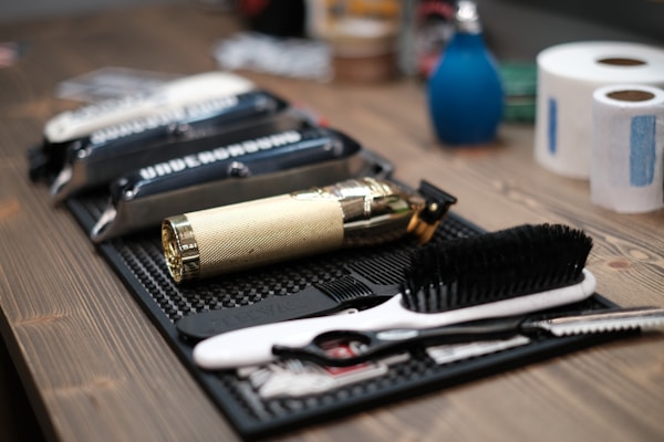 A barber's chair in a stylish barbershop with tools neatly arranged.