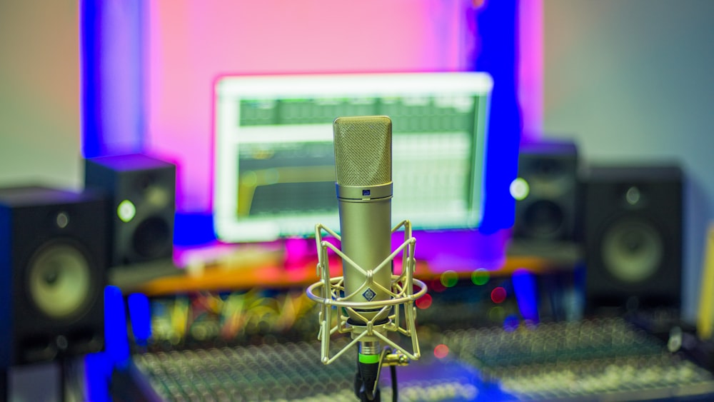 a microphone sitting in front of a computer monitor