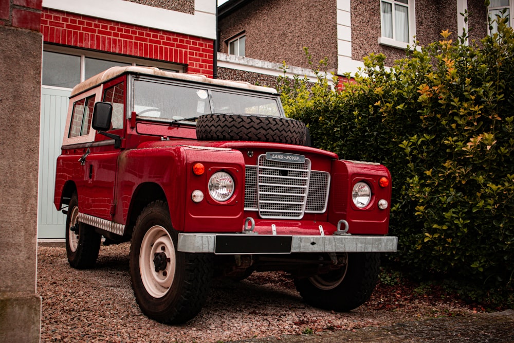 a red truck parked in front of a building