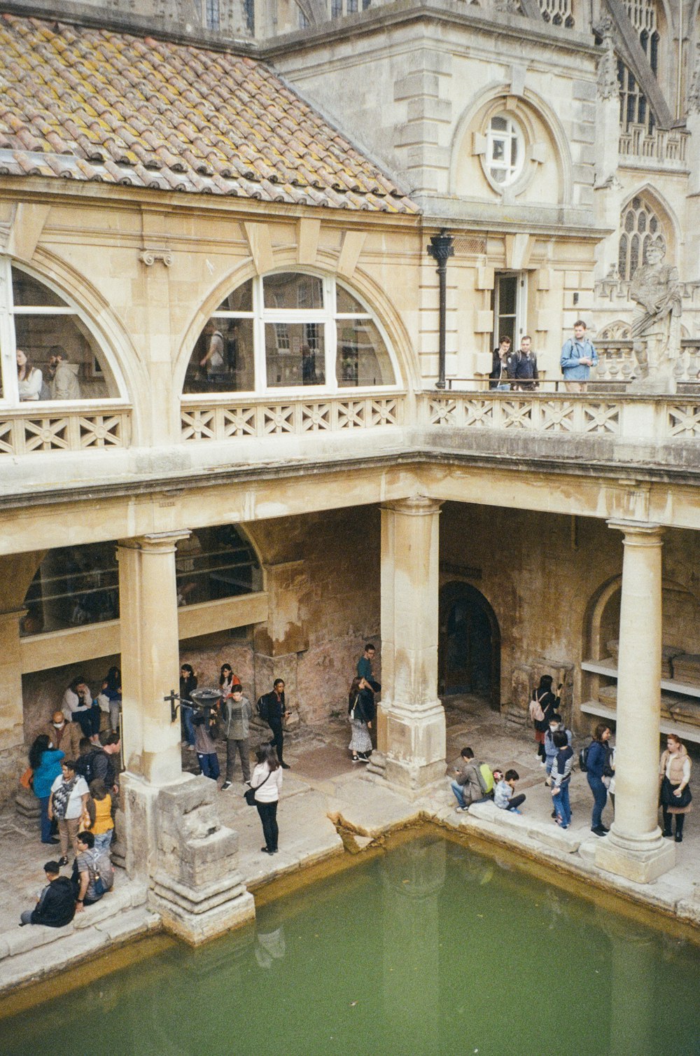 a group of people standing outside of a building