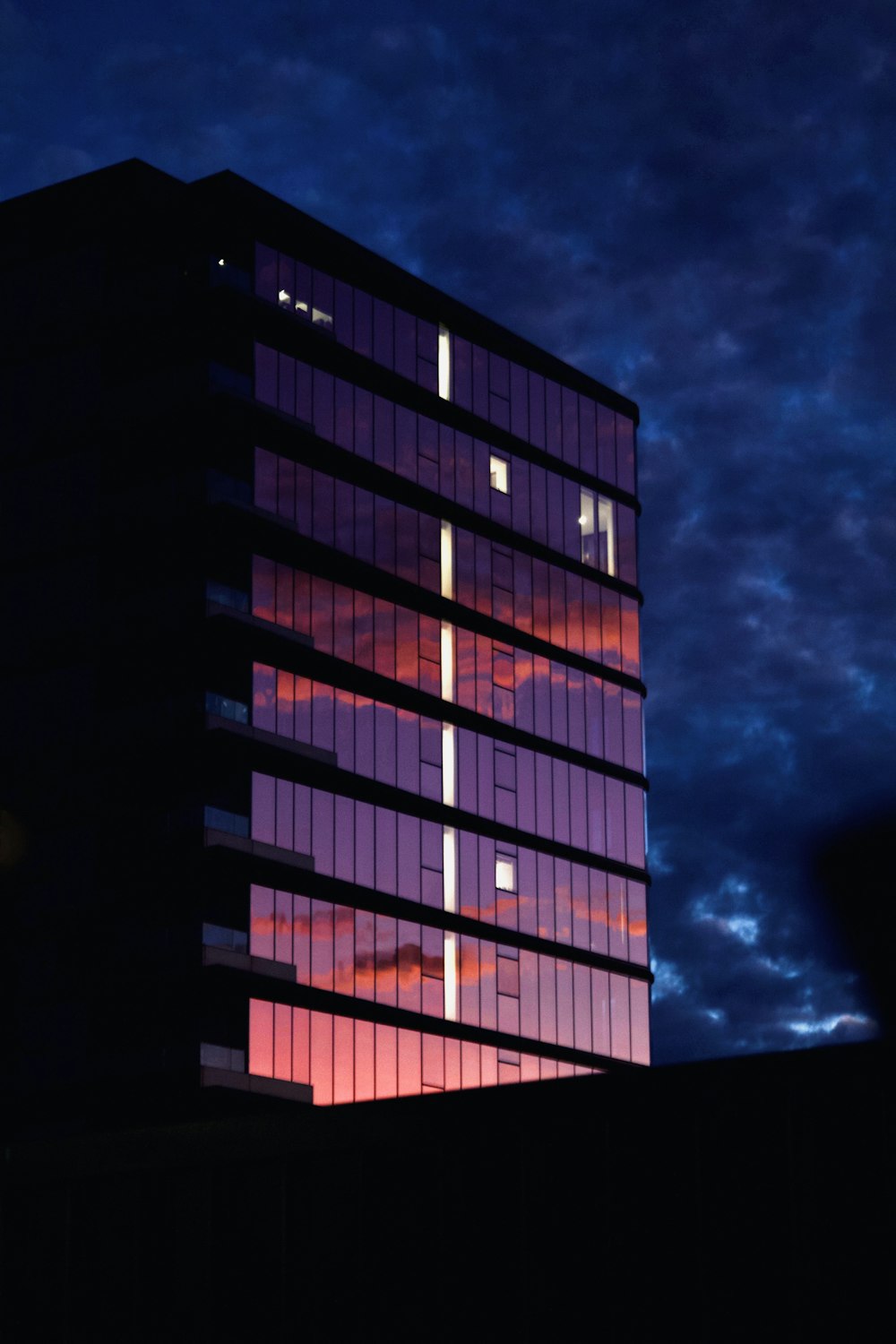 a very tall building with a sky in the background