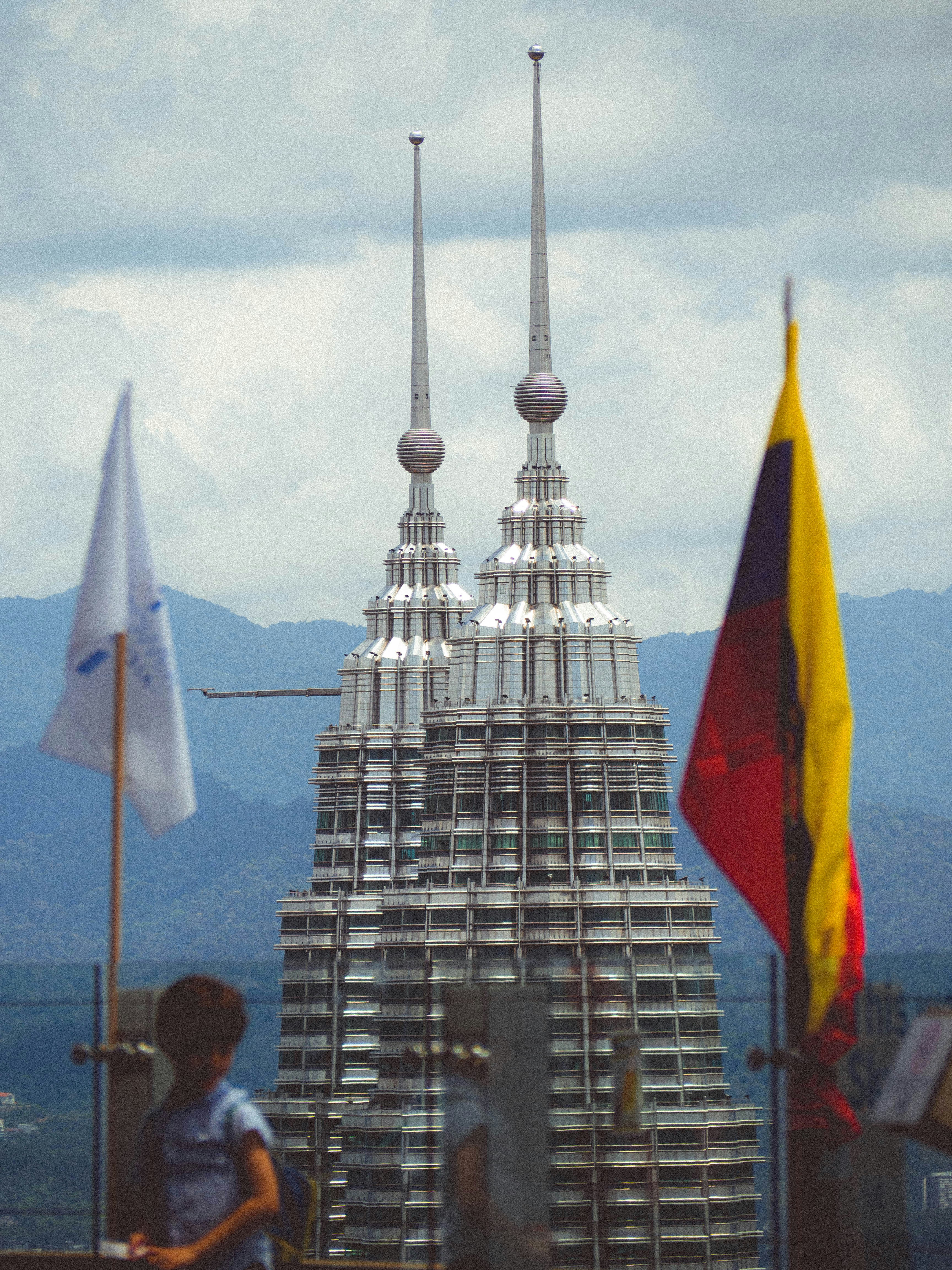 a tall building with two spires on top of it