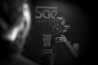 a man holding a camera in front of his face