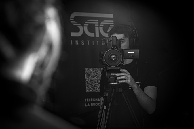 a man holding a camera in front of his face