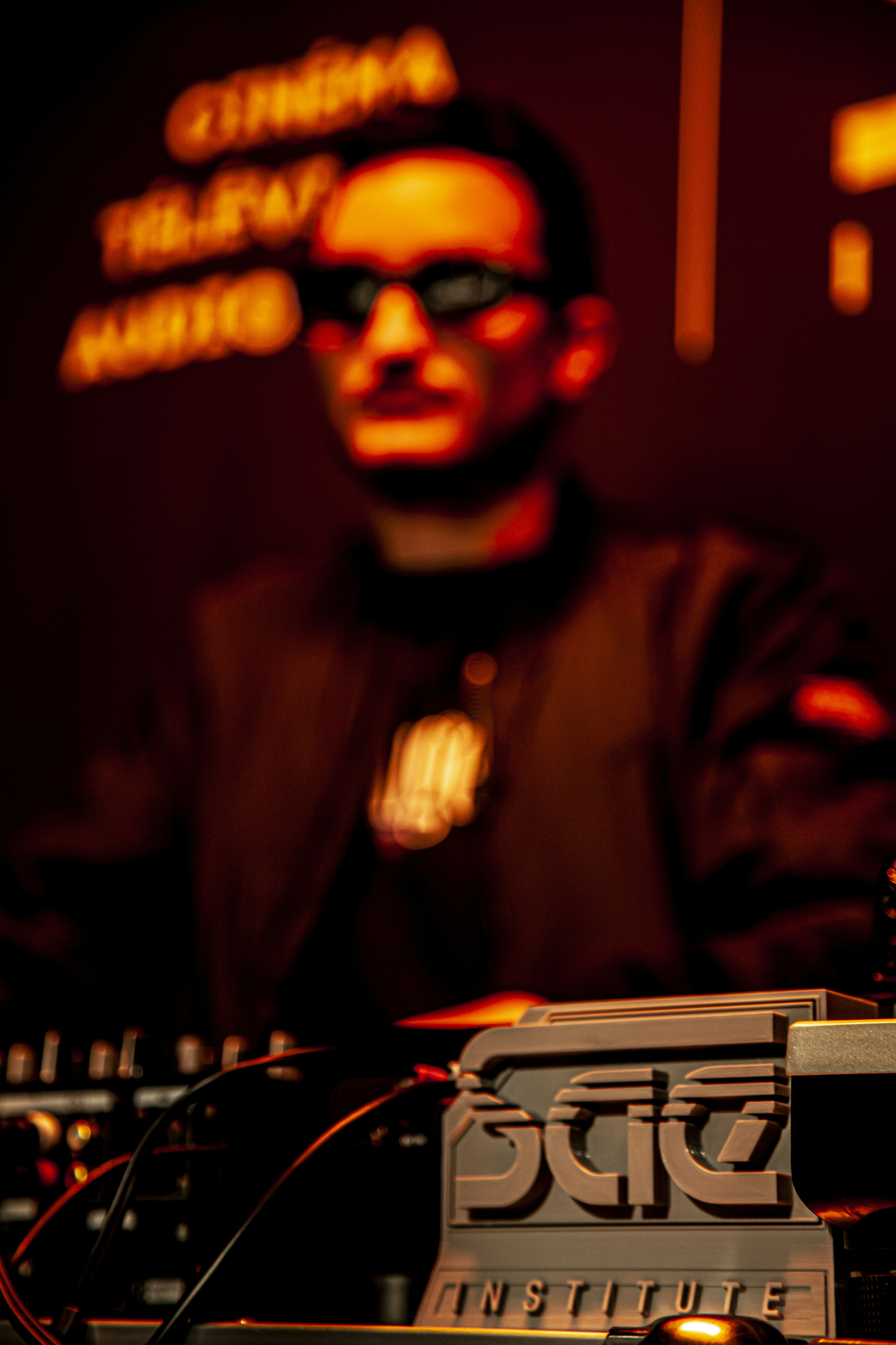 a man in a dark room with a microphone