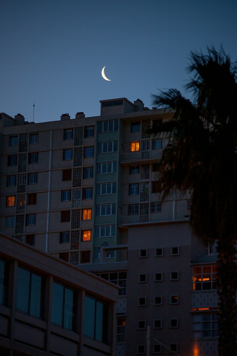 a building with a half moon in the sky