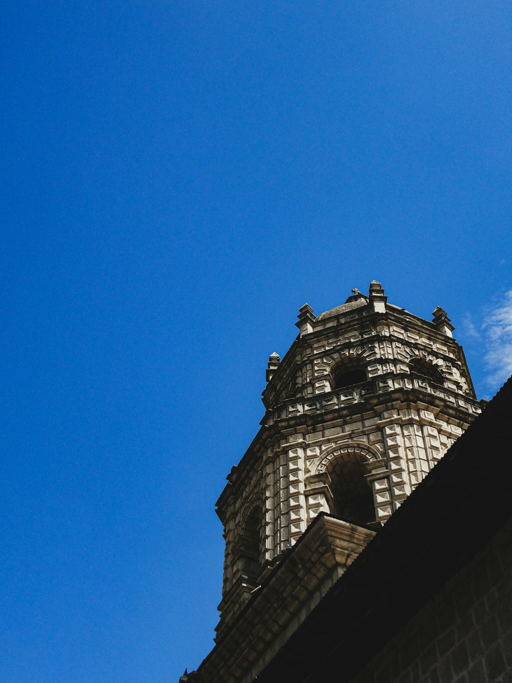 a tall clock tower towering over a city