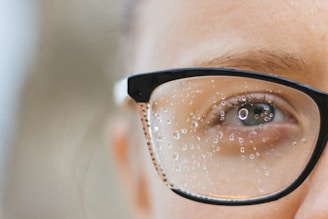 a close up of a person wearing glasses