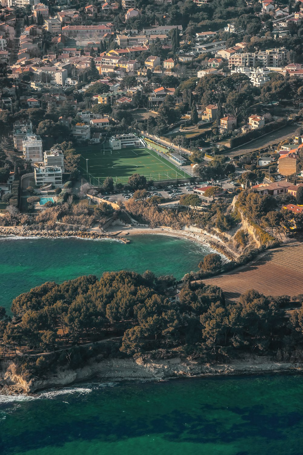 an aerial view of a city and a body of water