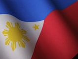 the flag of the philippines is waving in the wind