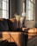 A clean and bright living room with sunlight streaming through the windows, showcasing a fresh and inviting atmosphere.