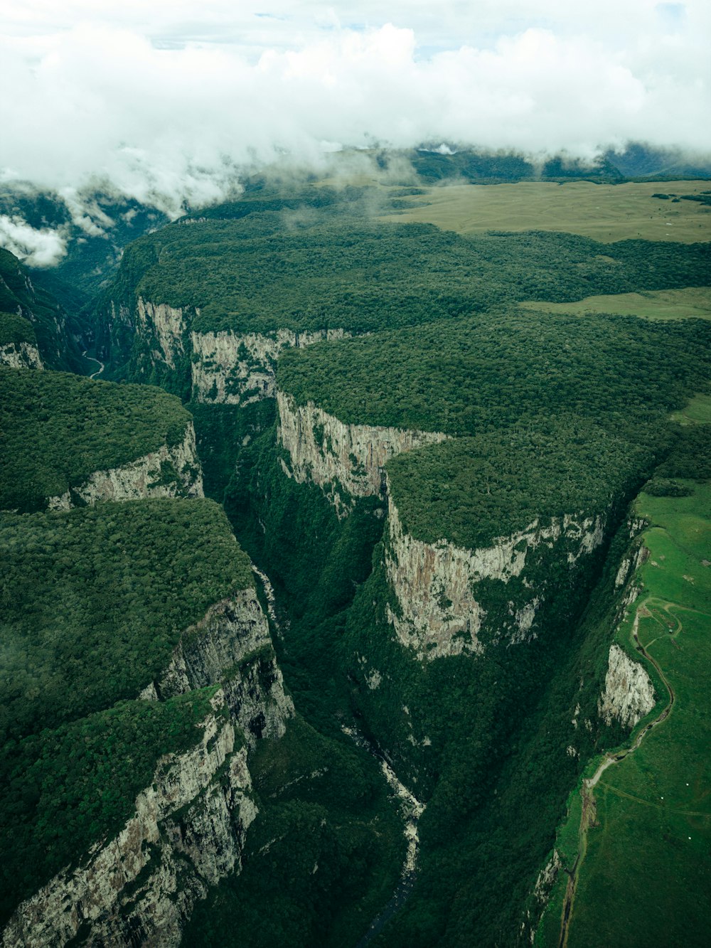 an aerial view of a mountain range with a river running through it