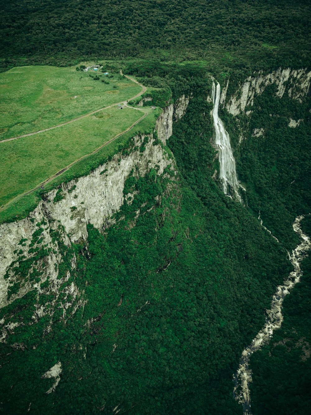 an aerial view of a lush green valley