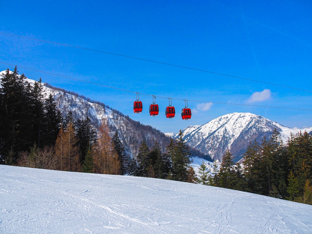 a ski slope with a ski lift in the background