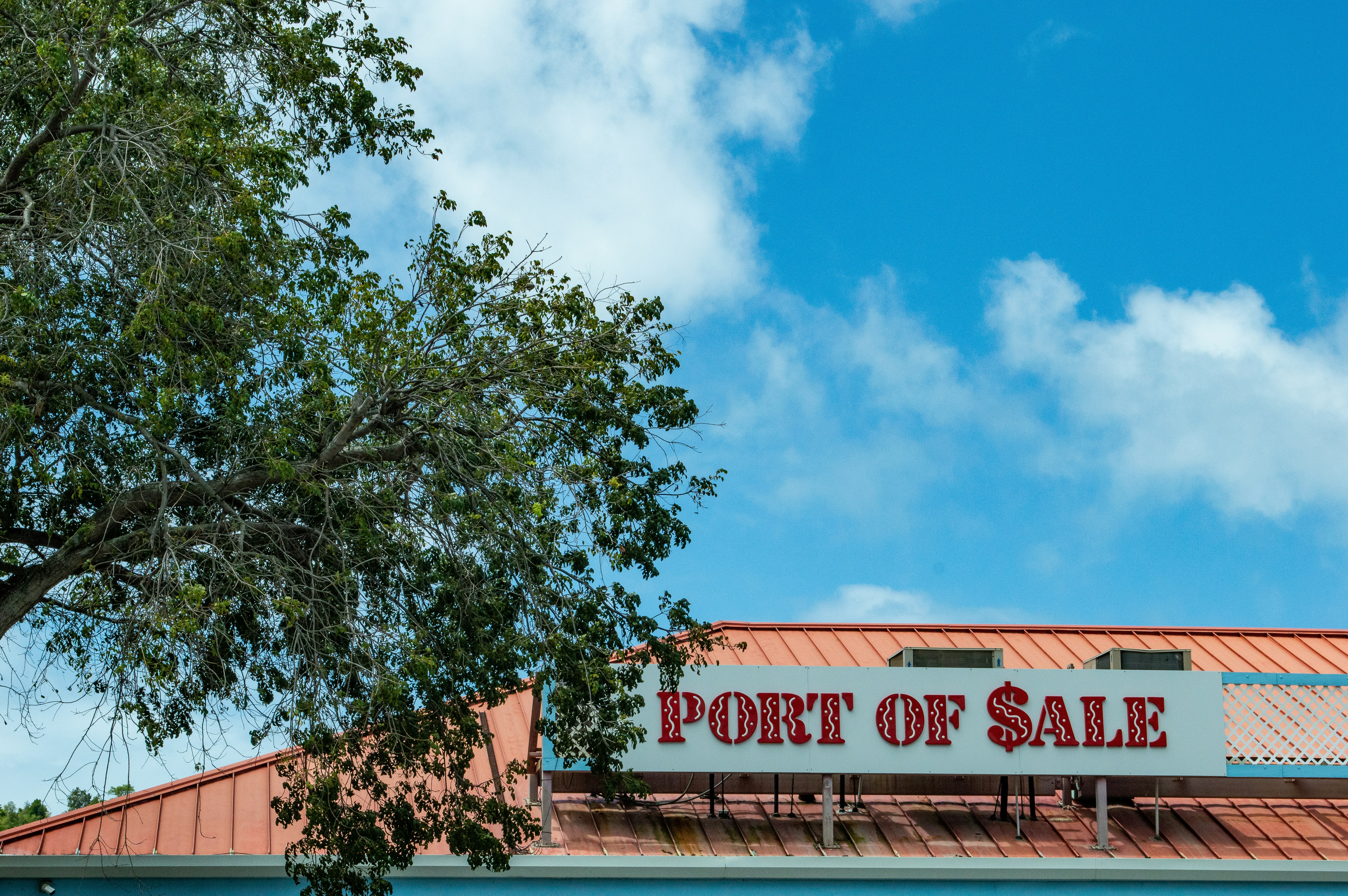 a sign that reads port of sale on the side of a building, Port of Sale shopping area in Charlotte Amalie, on St Thomas, U.S. Virgin Islands.