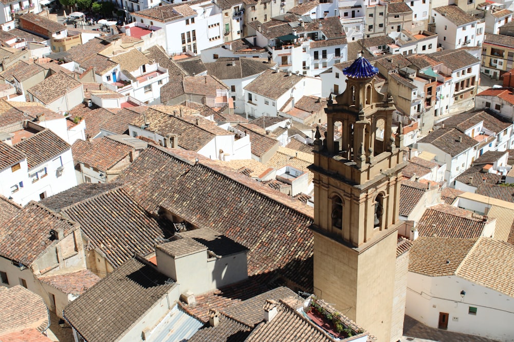 an aerial view of a city with a clock tower