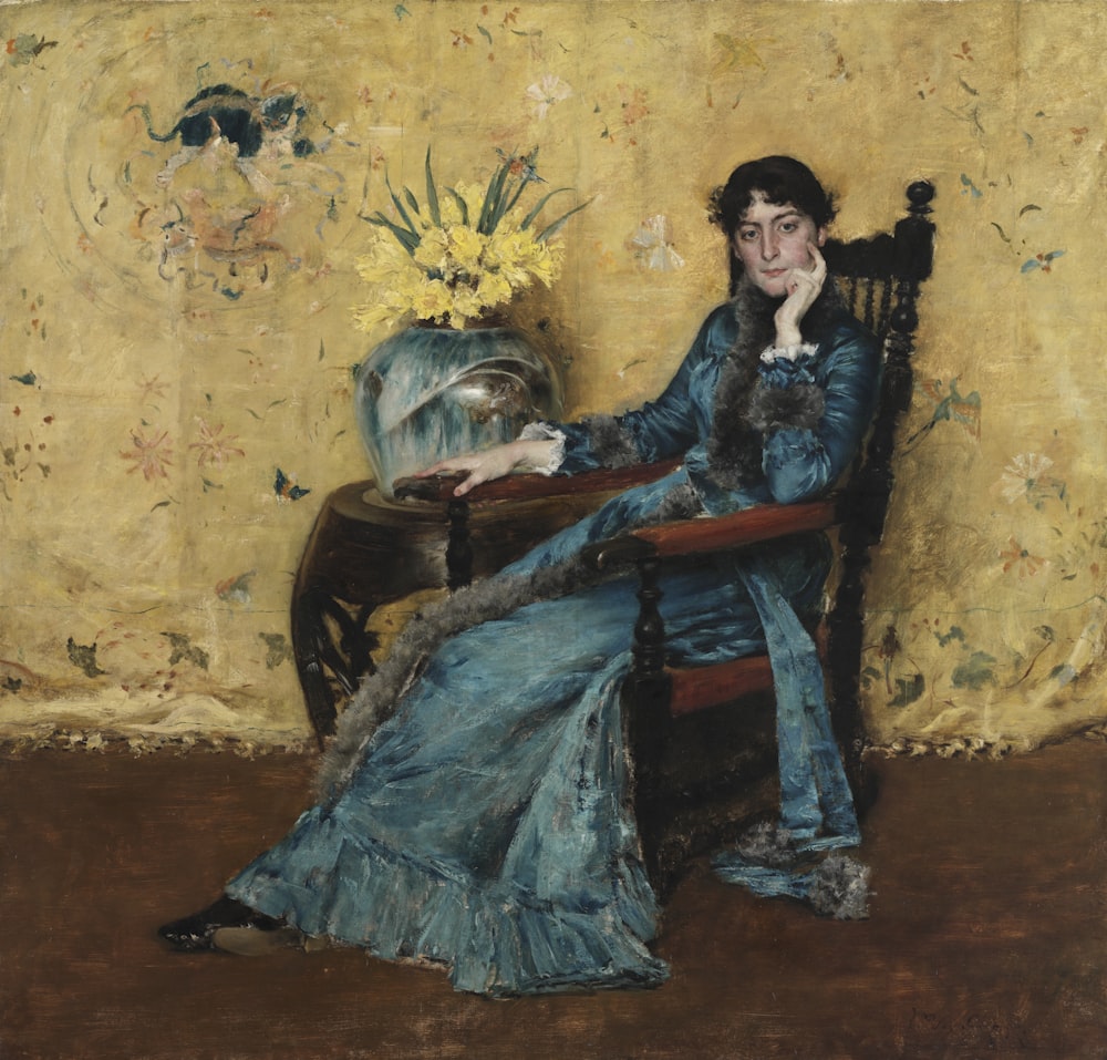 a painting of a woman sitting in a chair