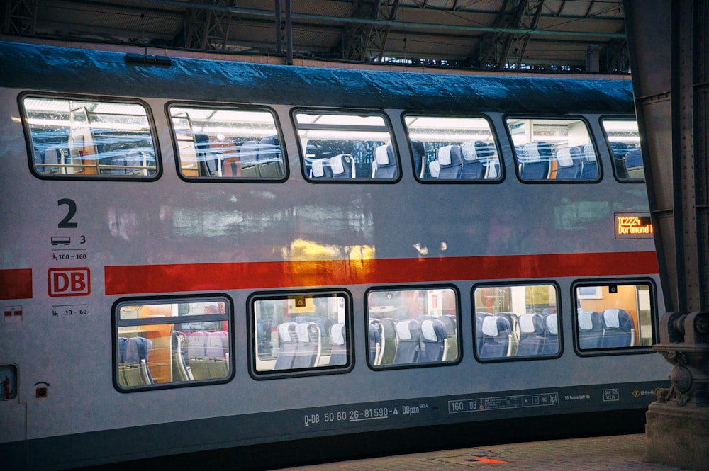 a double decker bus is parked in a station