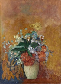 A still life painting featuring a vase filled with a vibrant assortment of flowers in various colors, including orange, yellow, and blue, set against a textured, earthy-toned background. The flowers appear lush and detailed, with leaves interspersed among them.