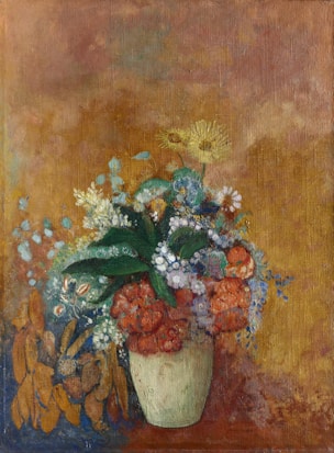 A still life painting featuring a vase filled with a vibrant assortment of flowers in various colors, including orange, yellow, and blue, set against a textured, earthy-toned background. The flowers appear lush and detailed, with leaves interspersed among them.