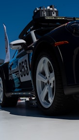 A sleek car roof with a sturdy bicycle rack carrying two bikes.