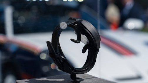 Close-up of a health-tech device being showcased by an influencer in a high-tech environment.