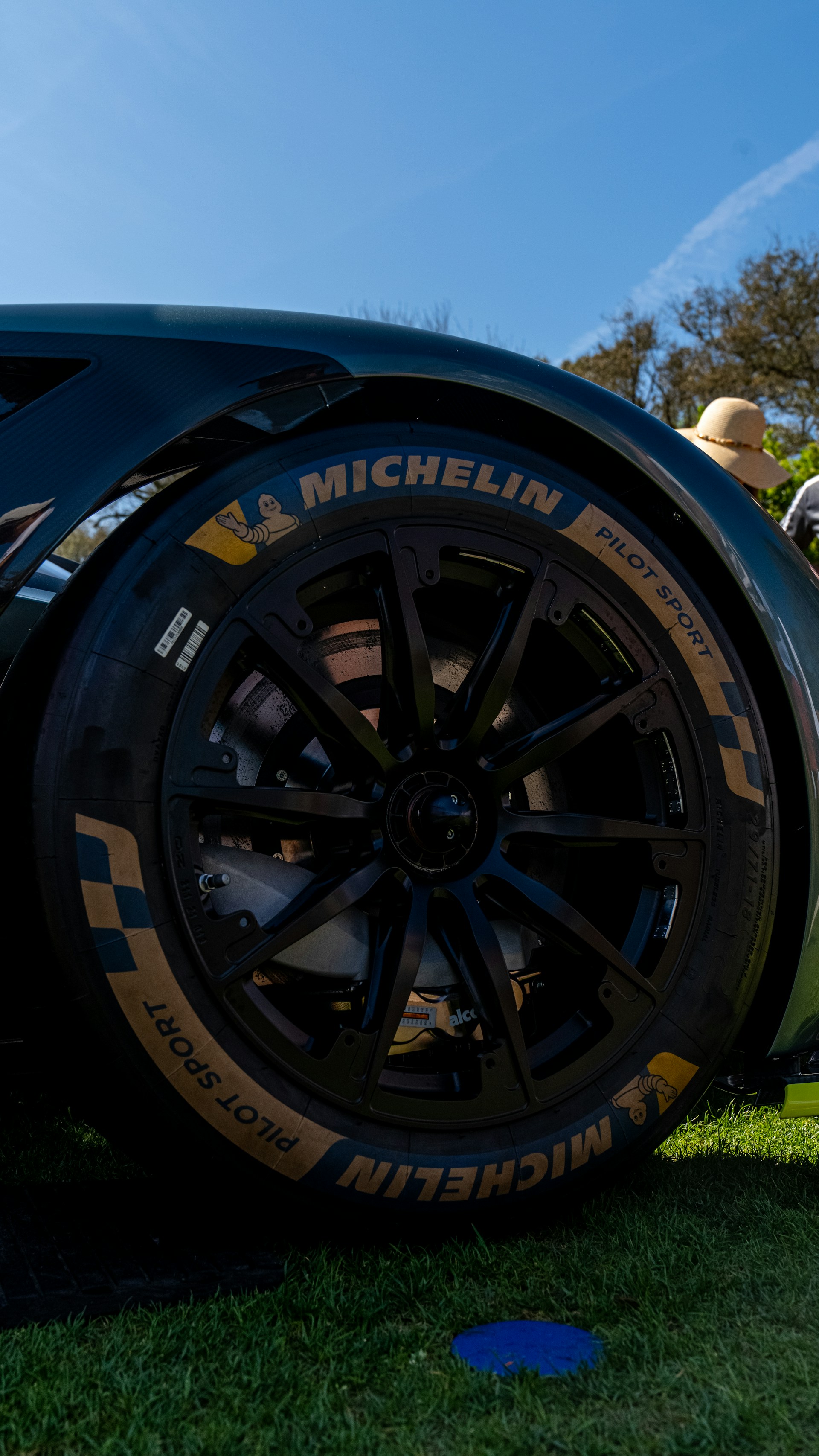 a close up of a tire on a sports car