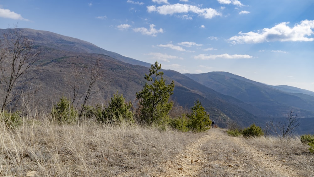 a dirt road in the middle of a mountain range