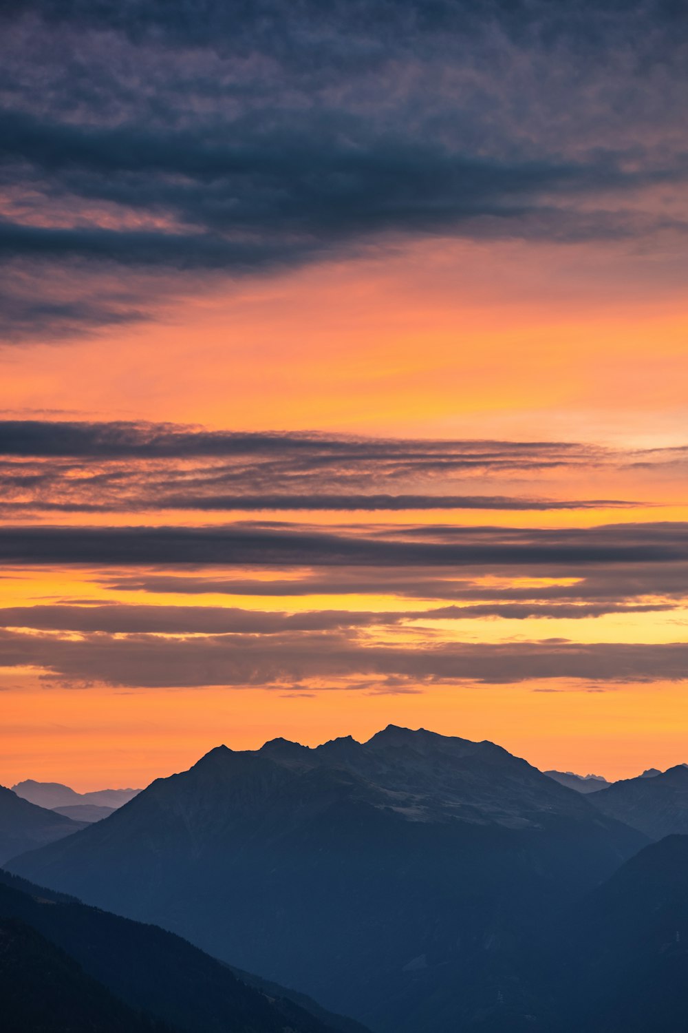 a view of a mountain range at sunset