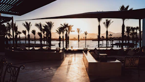 Sunset view of the terrace with warm lighting and cozy seating.