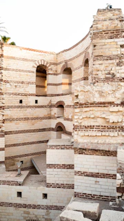 Ancient stone walls with visible restoration work preserving Puebla's heritage.