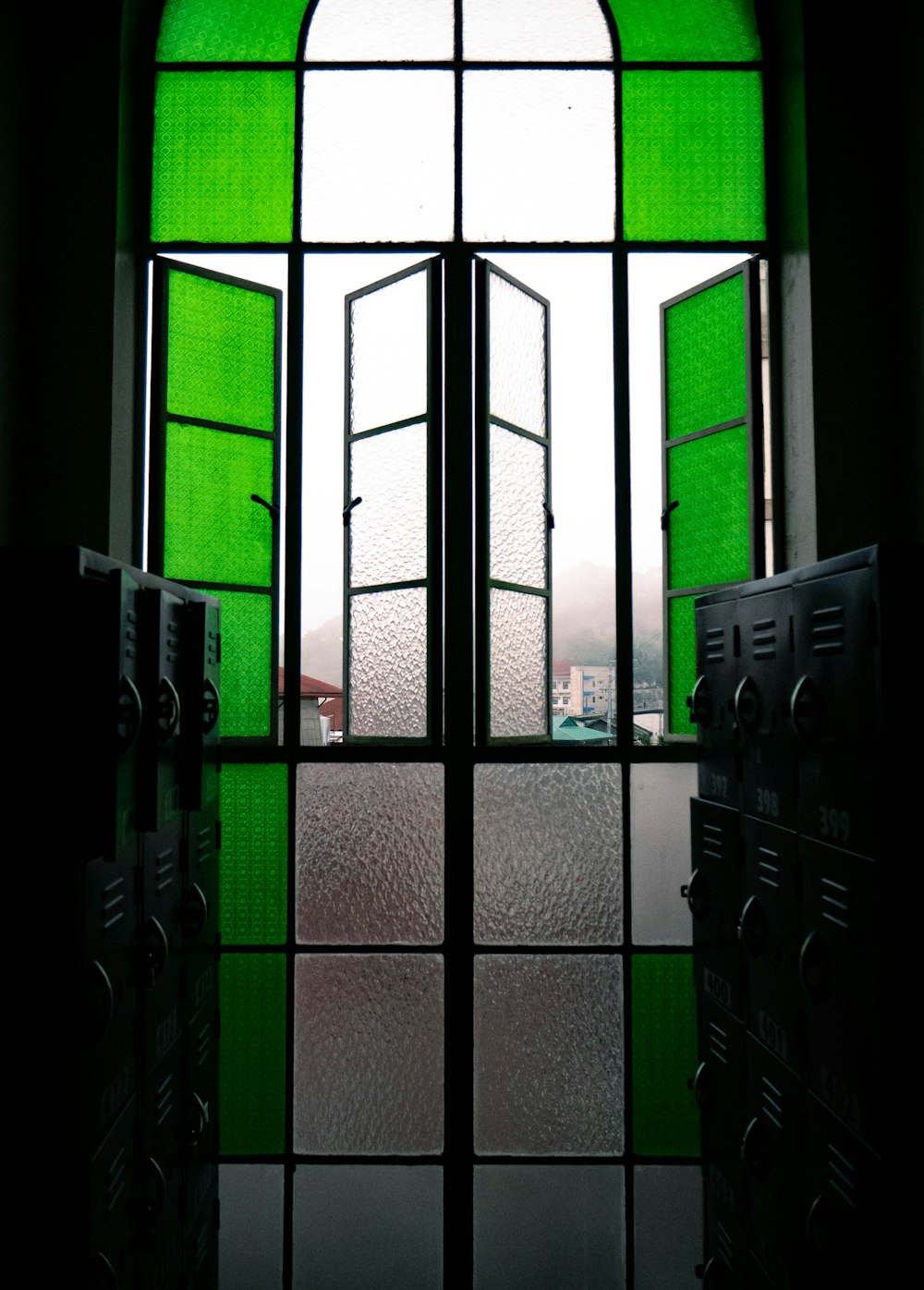a window with a green glass covering it