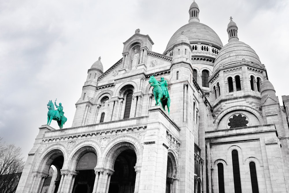 a large building with statues on the front of it