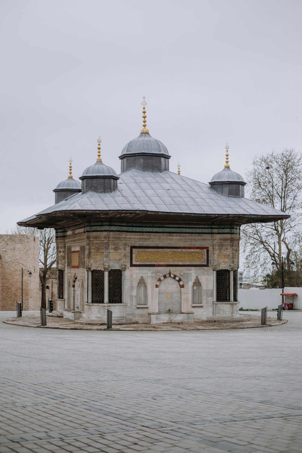 a small building with two domes on top of it