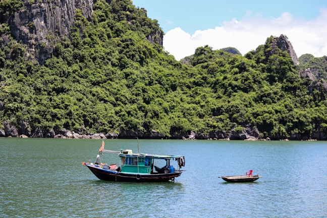 Colorful traditional boats floating on the turquoise waters of a tropical island