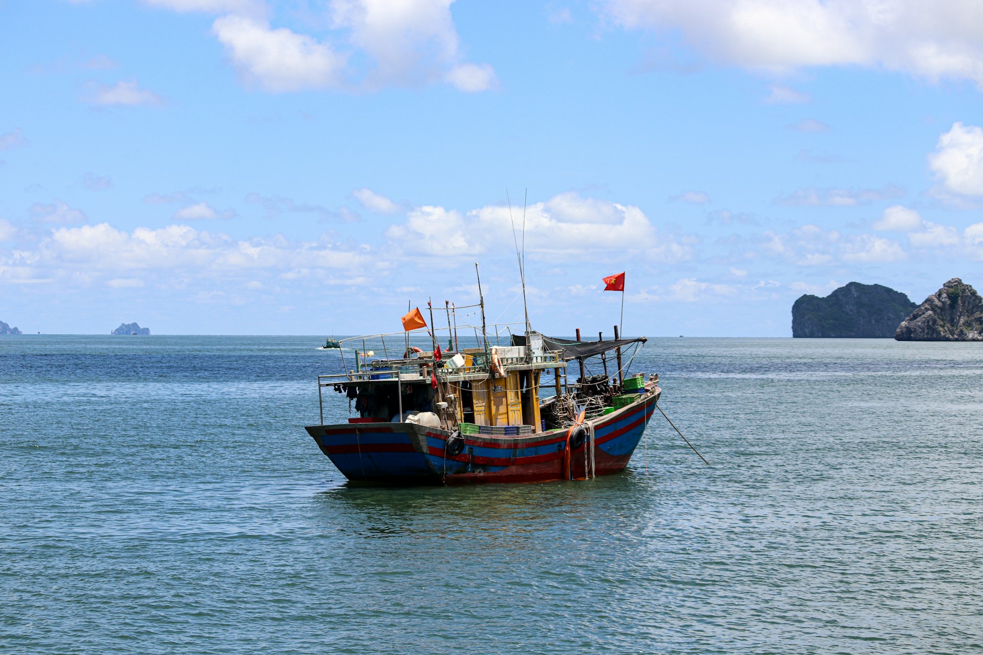 a boat floating on top of a large body of water