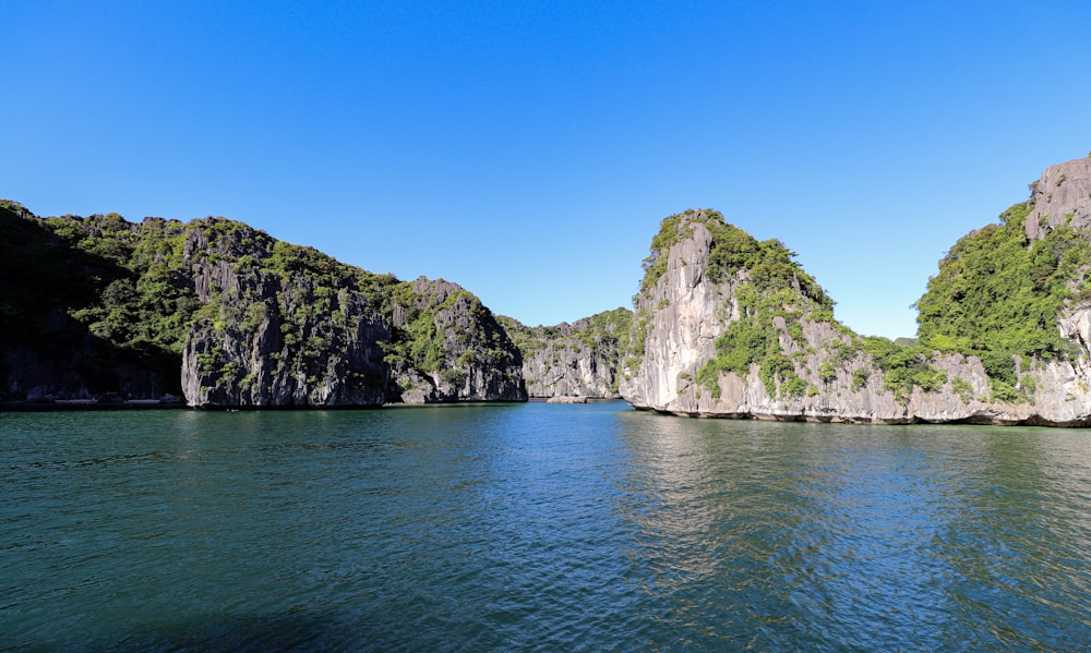 a body of water surrounded by mountains and trees